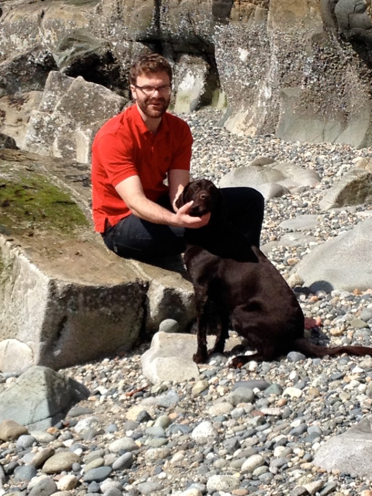 What may look like a nice moment between Peter and Bella but was actually Peter prying something out of Bella's mouth. She likes to find gross things on the beach and try to eat them.